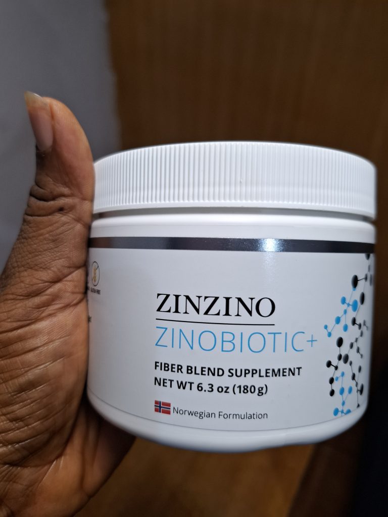 Picture of Zinbiotic held in the hand as an example of a supplement used to improve gut health in special children.